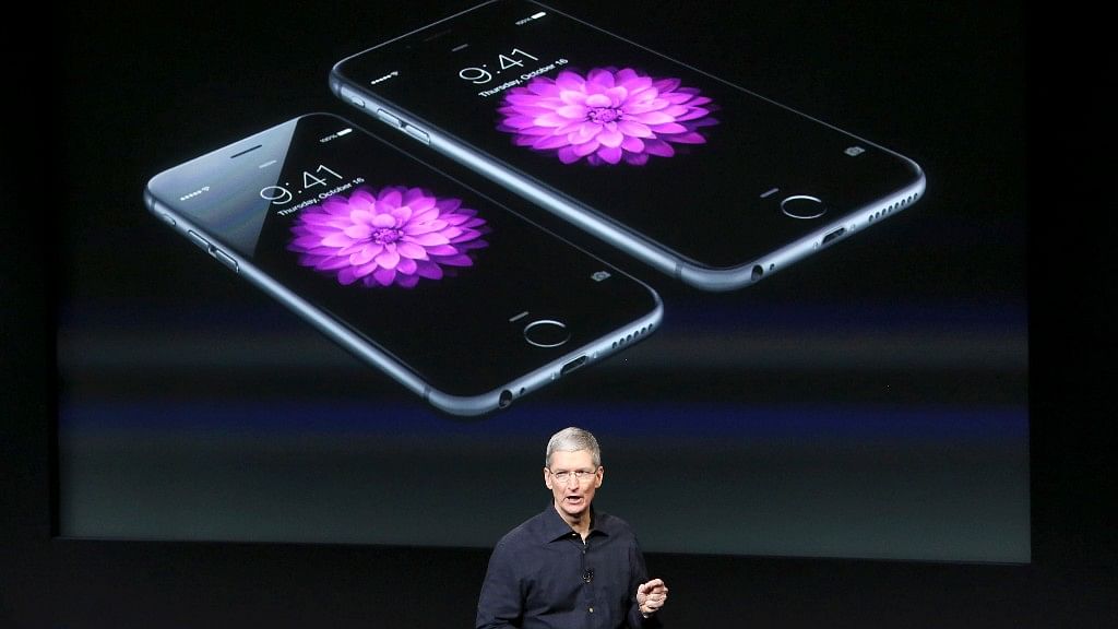 Apple CEO Tim Cook stands in front of a screen displaying the iPhone 6 during a presentation at Apple headquarters in Cupertino, California.&nbsp;
