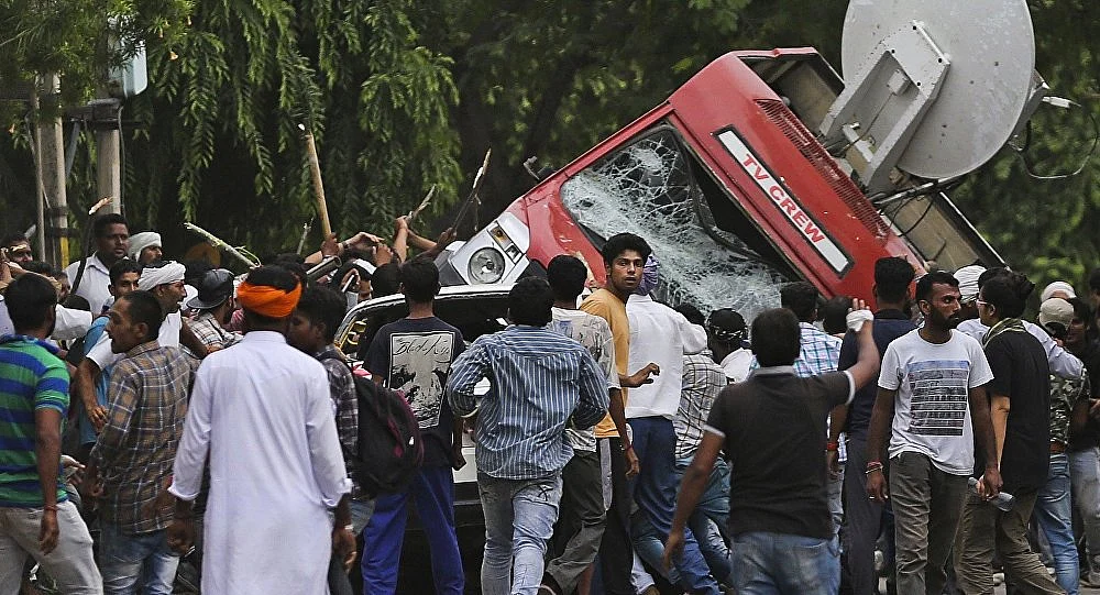 Deadly riots as rapist baba gets light sentence.