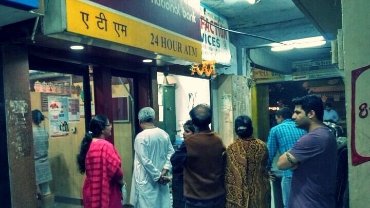 People wait  outside ATM kiosks. Photo used for representational purpose.&nbsp;