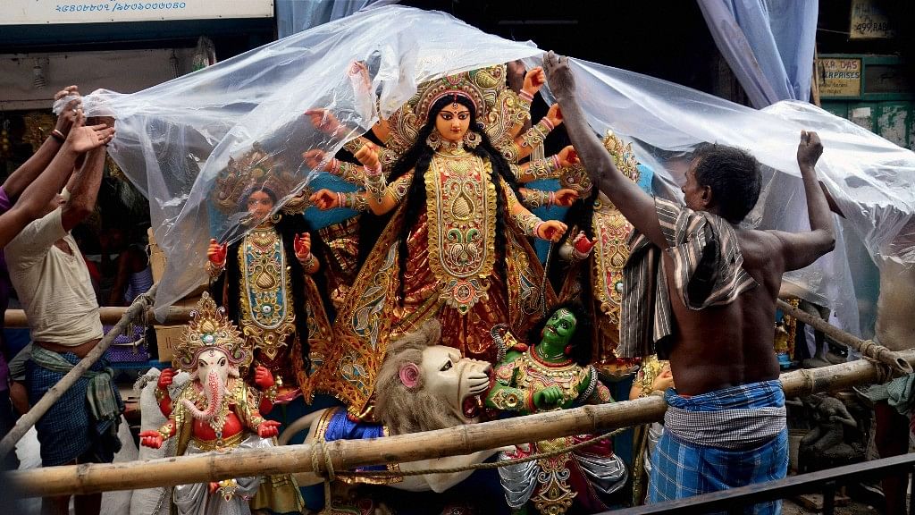 Many Hindus and Muslims across several puja marquees are working hard to make the five-day festival a success.