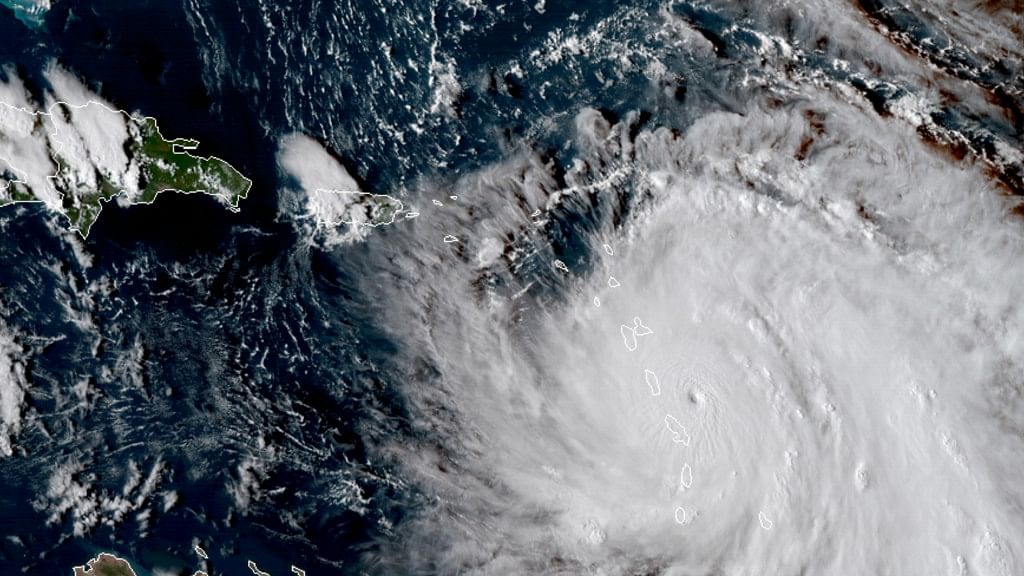 This Monday, 18 September 2017, GOES East satellite image provided by NASA shows the eye of Hurricane Maria as it nears Dominica.