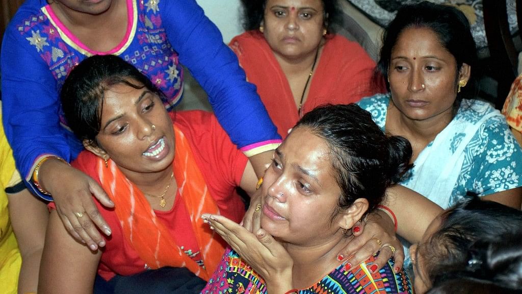 Relatives console the mother of the 7-year-old boy who was allegedly murdered at Ryan International School in Gurugram on Friday. &nbsp;