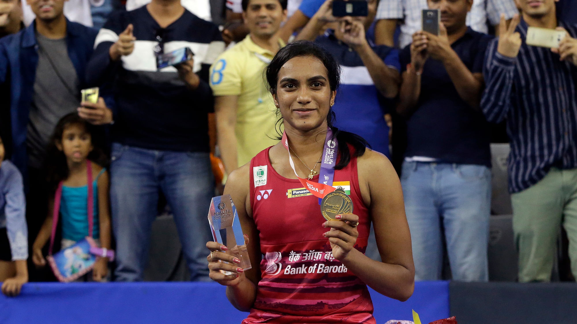 PV Sindhu poses with her gold medal and trophy during the awards ceremony after winning against Japan’s Nozomi Okuhara after the women’s single final at the Korea Open Badminton in Seoul.