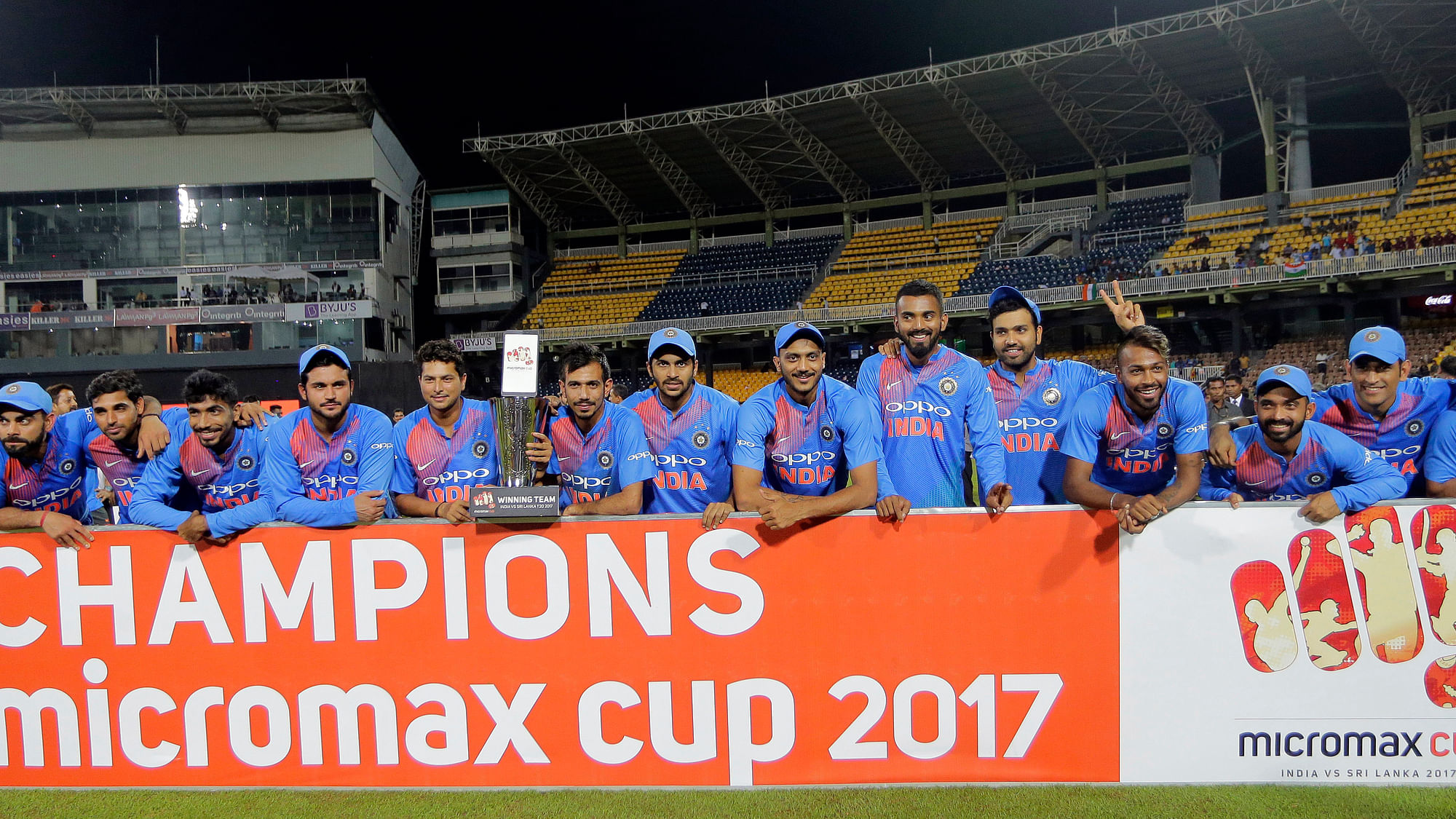 Members of Indian cricket team pose for photographers with the winners’ trophy after winning their only Twenty20 cricket match against Sri Lanka in Colombo<a></a>