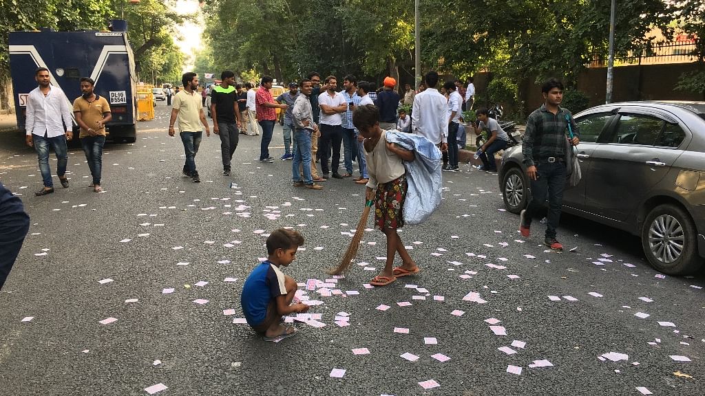 Young ragpickers left to pick up the trail of waste left behind by DUSU election campaigning.&nbsp;