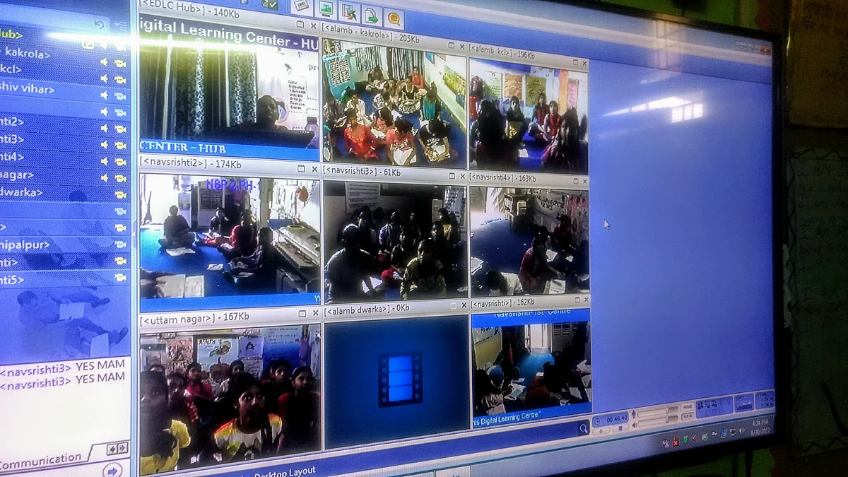 Are all students present? Each classroom is broadcast to the teacher through this screen, where she monitors discipline and answers questions. 