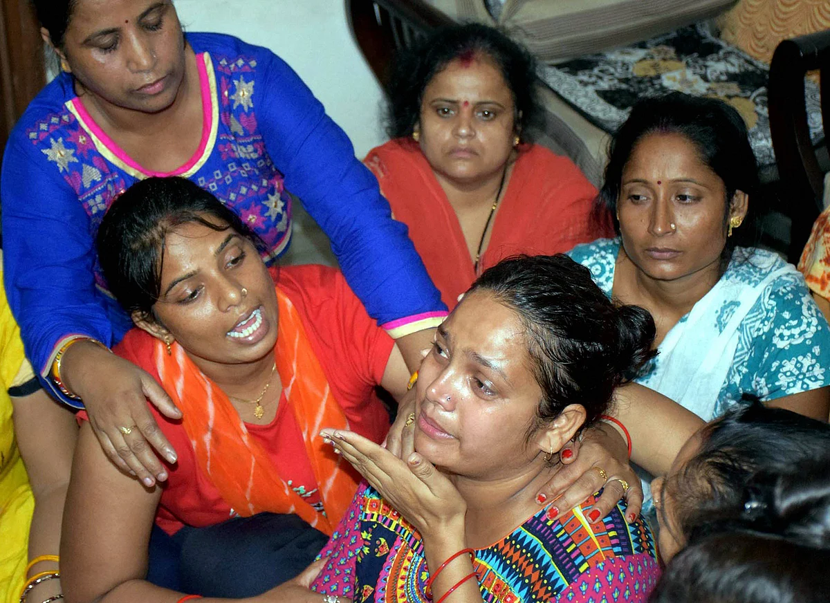 Relatives console mother of the student who was allegedly murdered at Ryan International School in Gurugram on Friday.