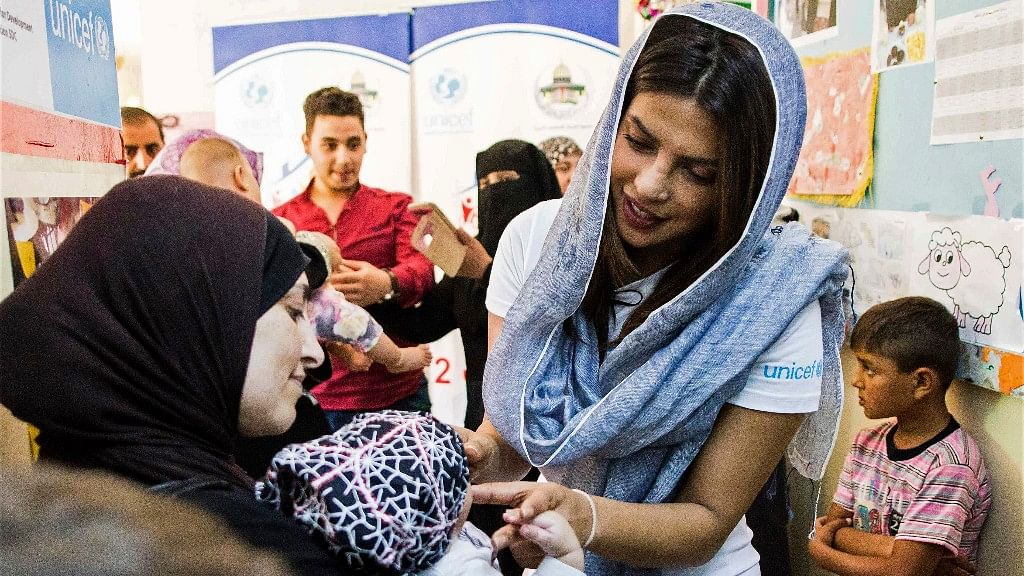 UNICEF Goodwill Ambassador greets a Syrian woman and her baby at UNICEF’s Makani Center in Amman, Jordan