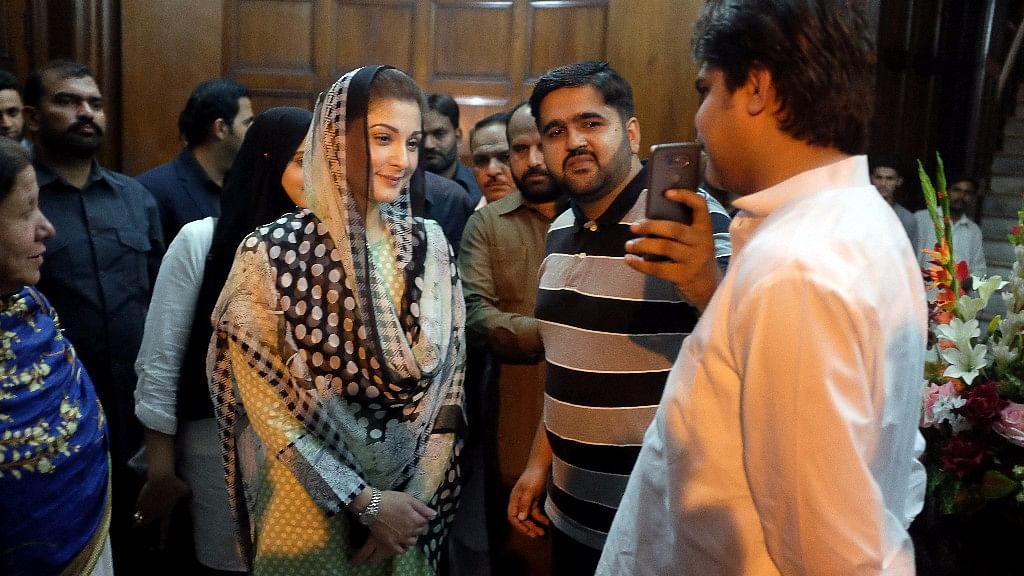 Maryam Nawaz, the daughter of Pakistan’s former Prime Minister Nawaz Sharif, takes a picture with a supporter at a rally in Lahore.