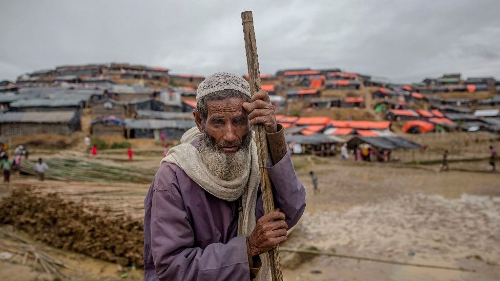 

A Rohingya Muslim, who crossed over from Myanmar into Bangladesh, stands on a roadside waiting for food aid in Balukhali refugee camp, Bangladesh, Monday, 18 September 2017.