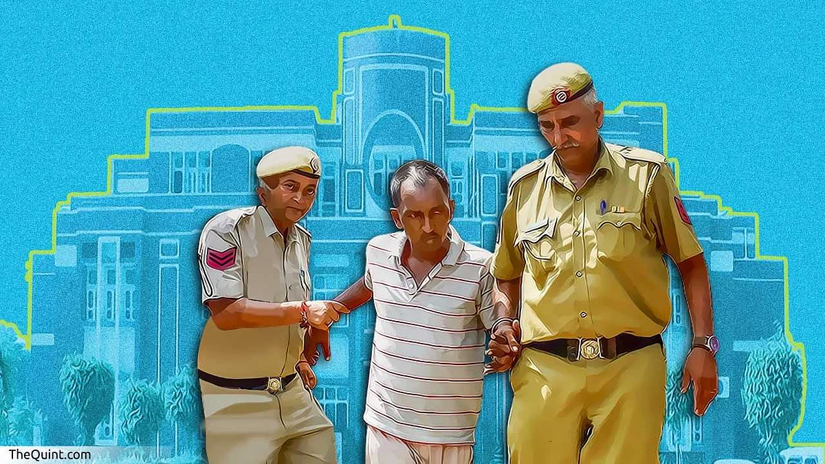 Accused Ashok Kumar being escorted by police on 9 September.