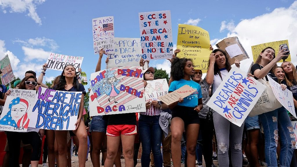 Supporters of Deferred Action for Childhood Arrival program (DACA) demonstrate on Pennsylvania Avenue in front of the White House in Washington.
