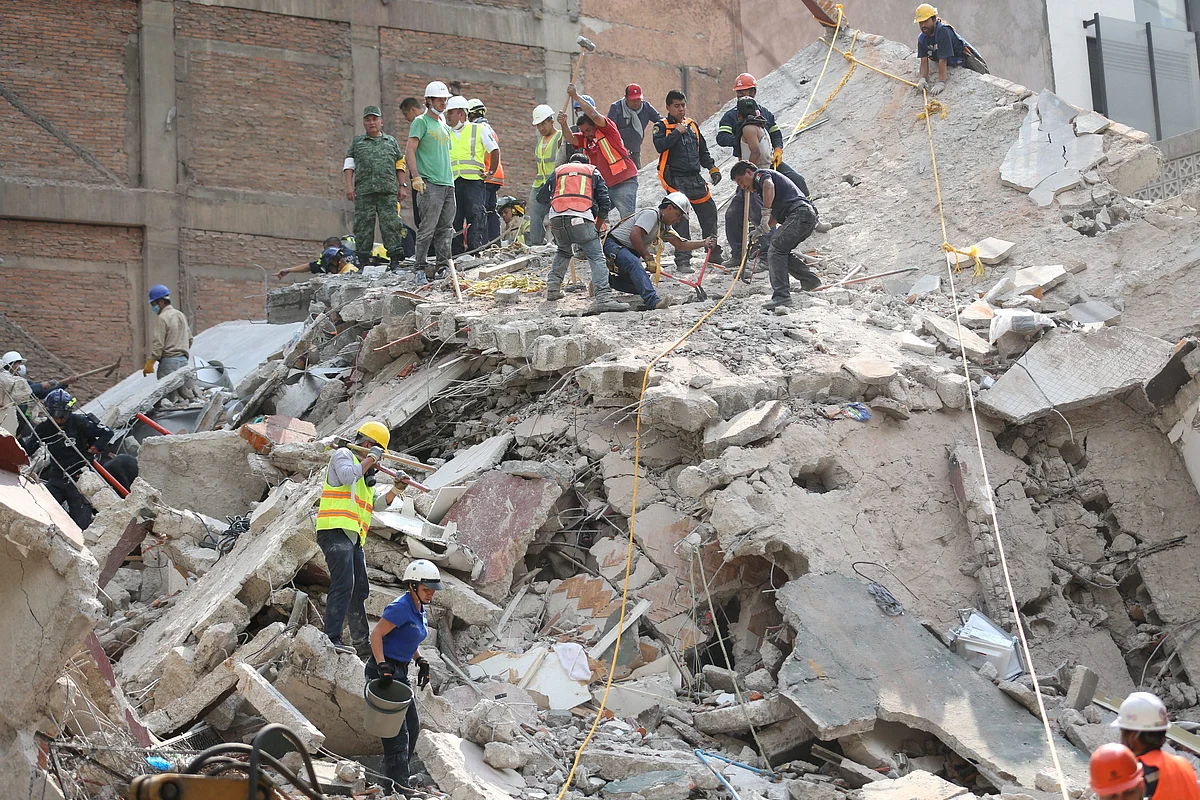 Mexico City : First responders work on removing the rubble of a collapsed building looking for survivors trapped underneath, after a 7.1 earthquake in Mexico City, Tuesday, Sept. 19, 2017. The earthquake stunned central Mexico, killing more than 100 people as buildings collapsed in plumes of dust.