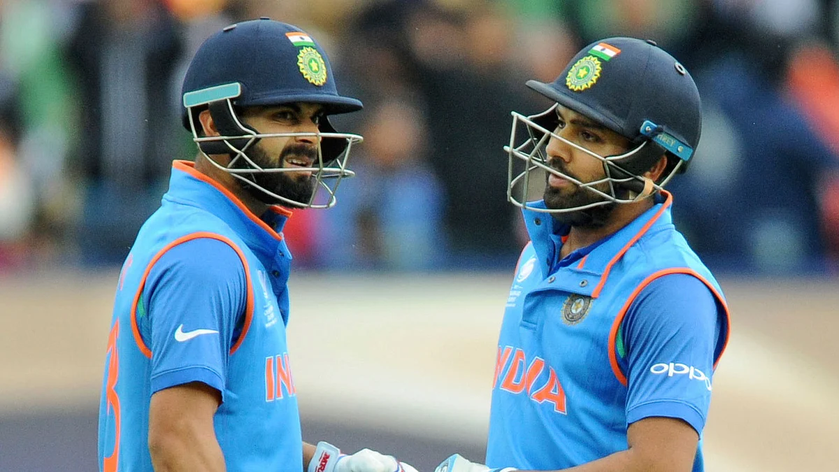Virat Kohli (L) and Rohit Sharma (R) share a moment during a Champions Trophy match.