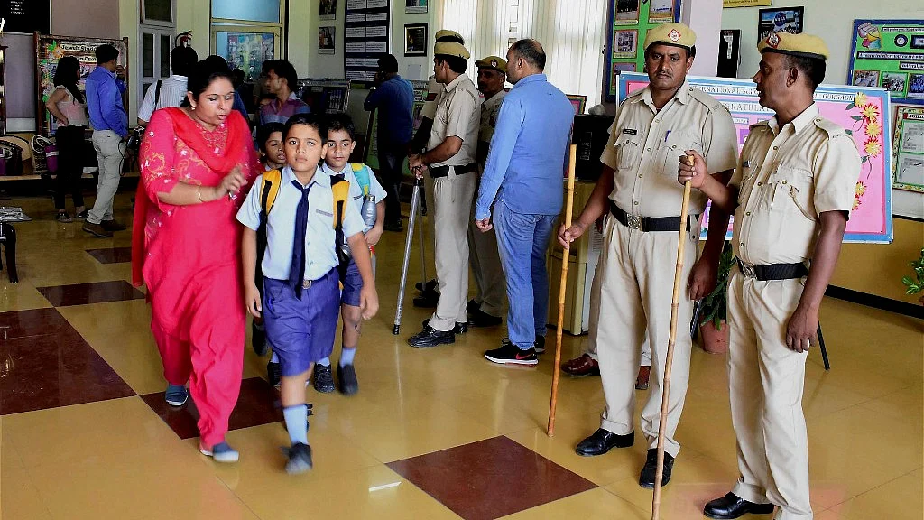 Parents taking their children back amid police presence after the murder of a 7-year-old boy at Gurugram’s Ryan International School. 