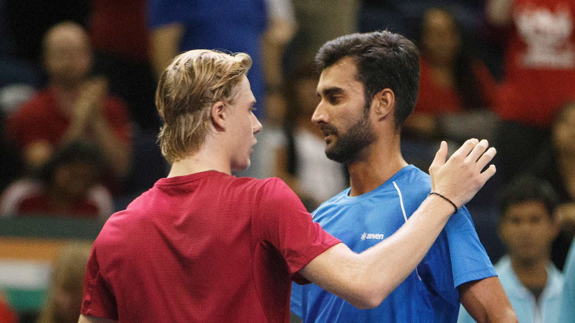 Canada’s Denis Shapovalov, left, and India’s Yuki Bhambri congratulate meet at the net after Shapovalov’s win during a Davis Cup match