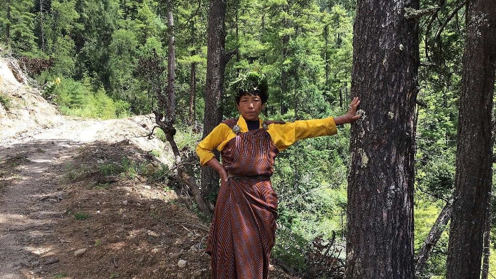 A Bhutanese priestess in the woods.&nbsp;