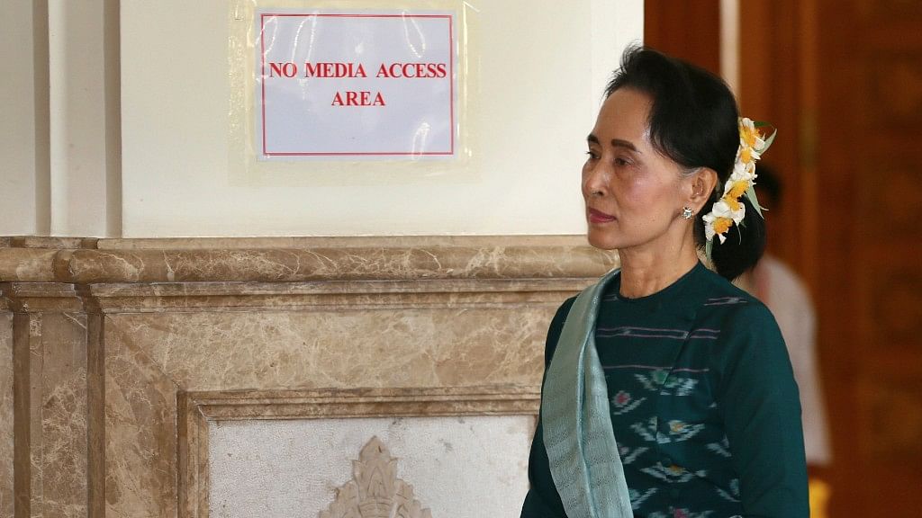 Aung San Suu Kyi walks in Myanmar’s Parliament in Naypyitaw.