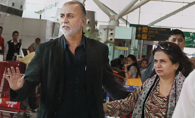Tarun tejpal arrives at the Delhi airport to leave for Goa on 29 November 2013.