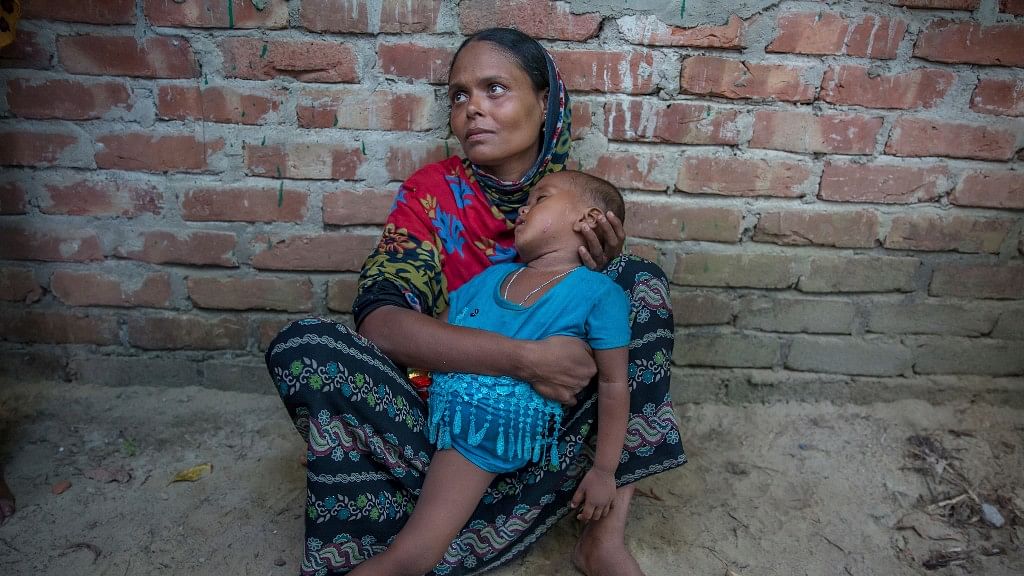 Ayesha Bibi, a Rohingya Muslim, grieves for her mother and two children after their boat capsized near  Bangladesh.