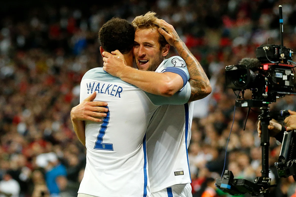 England’s Kyle Walker, left, hugs the scorer Harry Kane during the World Cup Group F qualifying soccer match between England and Slovenia at Wembley stadium in London, Thursday, Oct. 5, 2017<a></a>