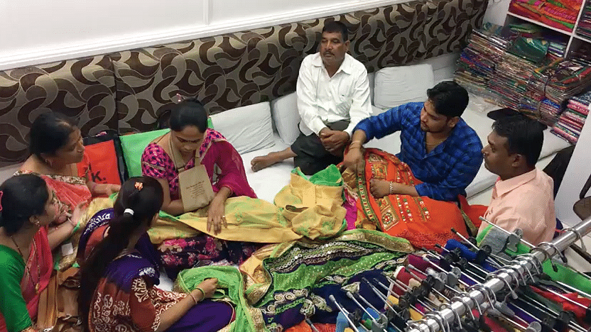 What do the textile traders in Surat think of the GST?