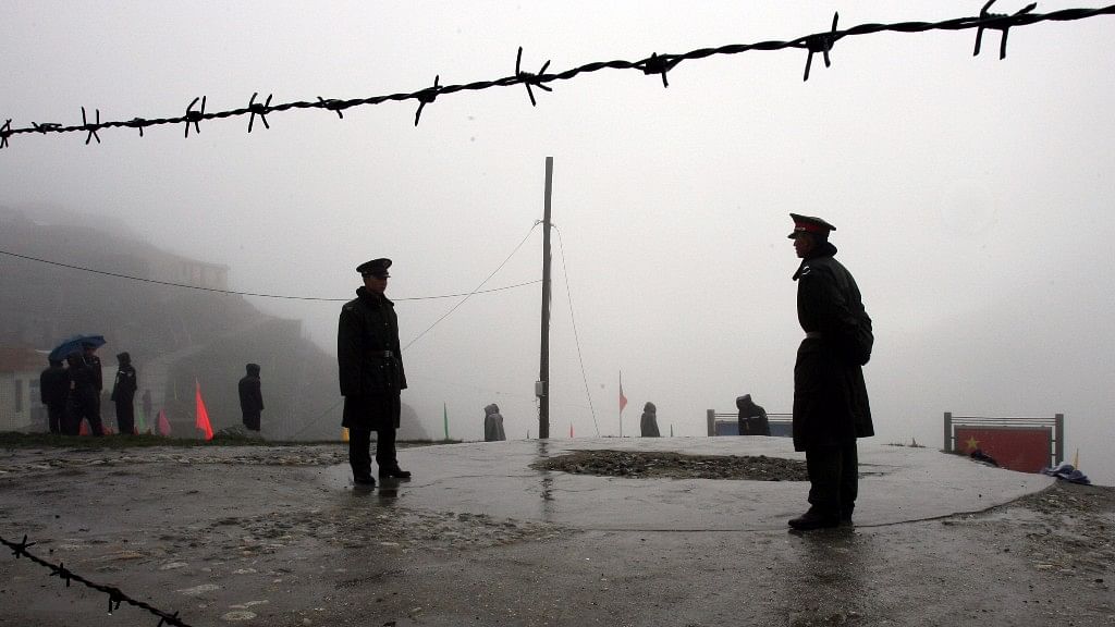 Chinese soldiers guard the border at Nathu La Pass.
