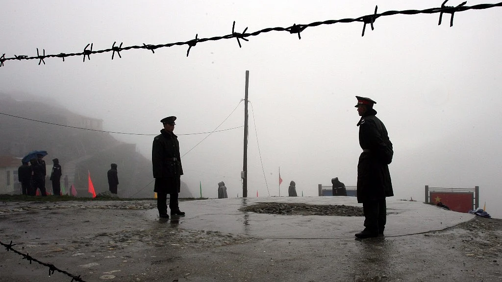 Chinese soldiers guard the border at Nathu La Pass.