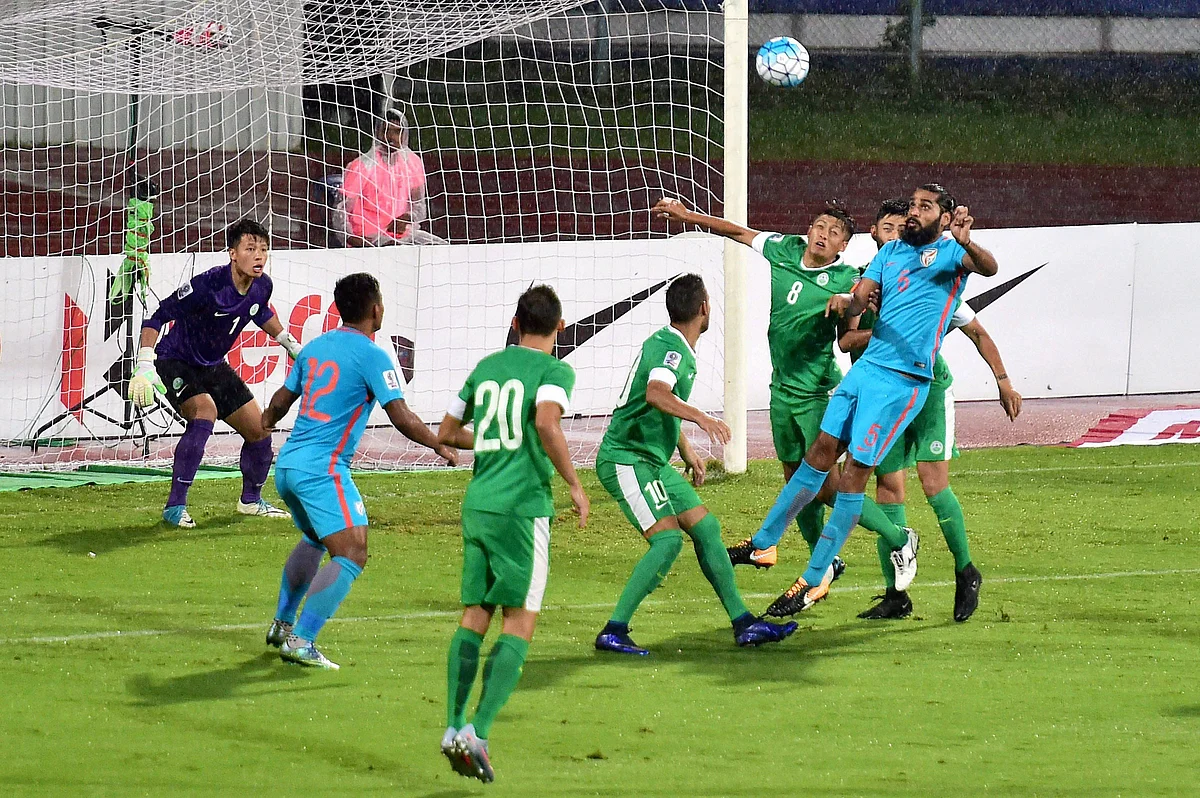 Indian and Macau footballers vie for the ball during the AFC Asian Cup qualifier match at Kanteerava Stadium in Bengaluru on Wednesday. 