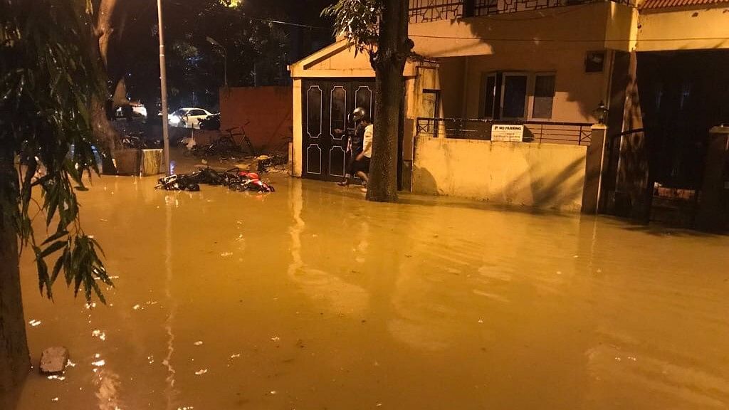 Residents of Koramangla in Bengaluru are using boats to navigate through the water after regular rains.