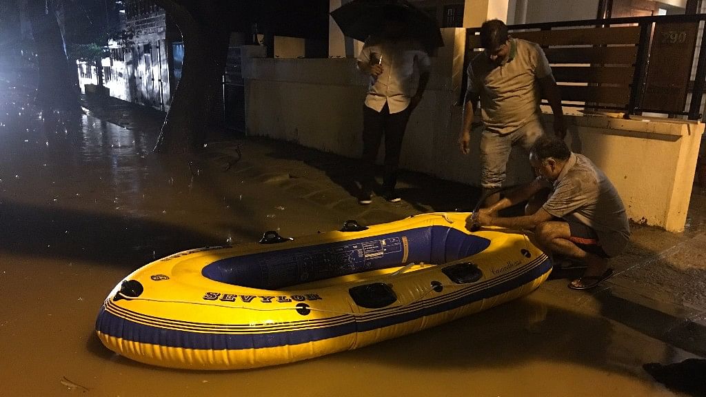 

Residents of Koramangala are using a boat after roads turn into rivers following the recent downpour.