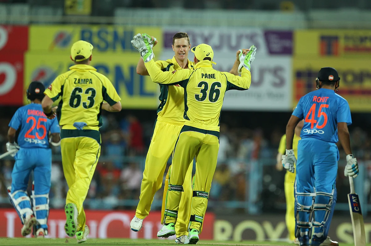 Jason Behrendorff celebrates a wicket with his teammates.