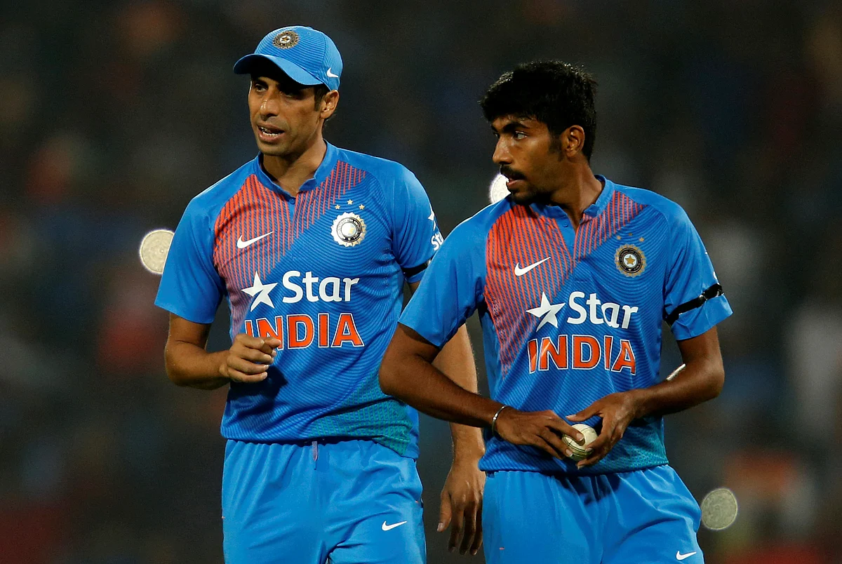 Ashish Nehra shares a moment with Jasprit Bumrah.