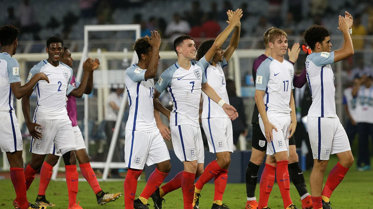 The England team celebrate after beating Brazil.