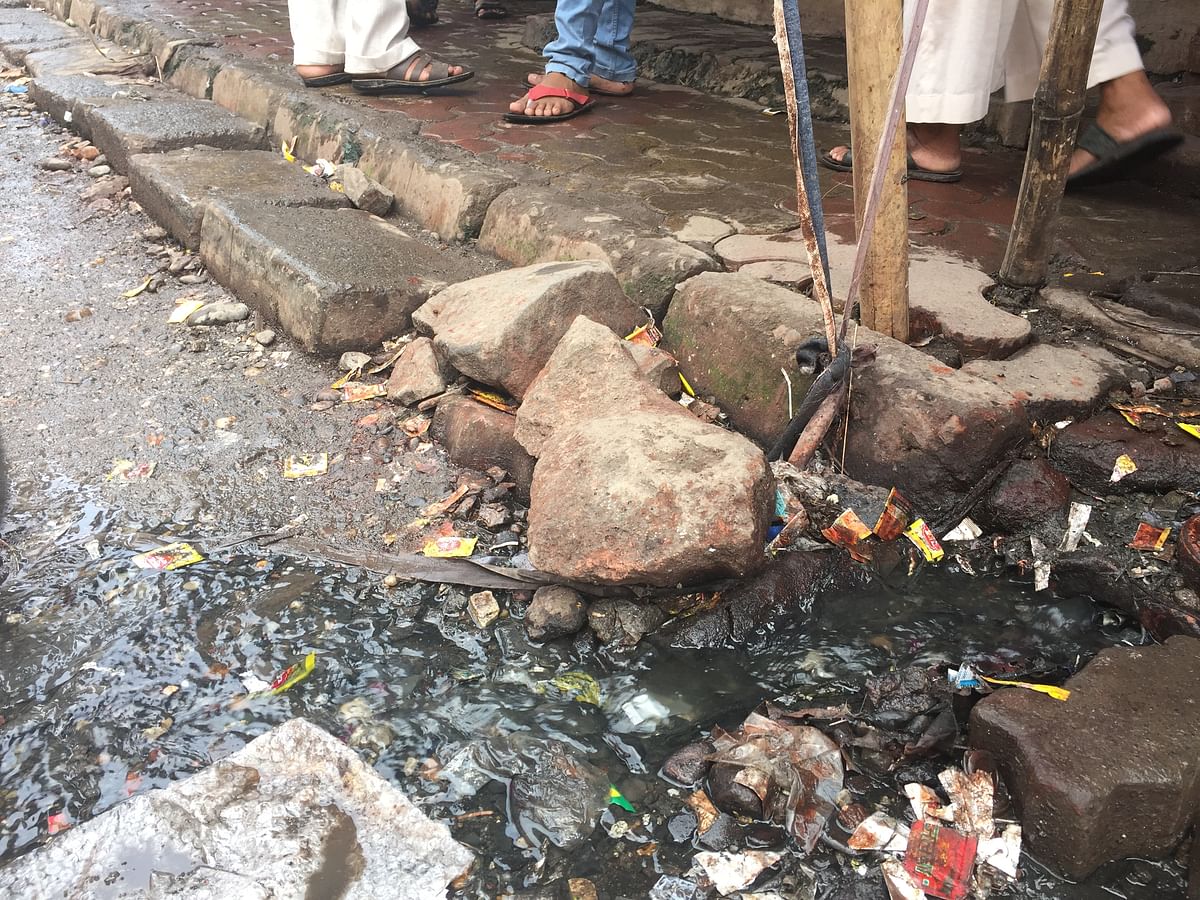 Potholes, overflowing drains, and filth – has the BMC forgotten about this road in Mumbai’s Saki Naka area?