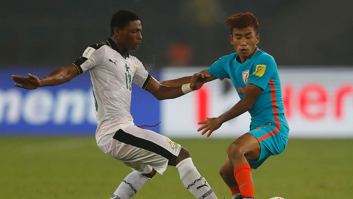 India’s Boris Thangjam, right, and Ghana’s Gabriel Leveh vie for the ball. 