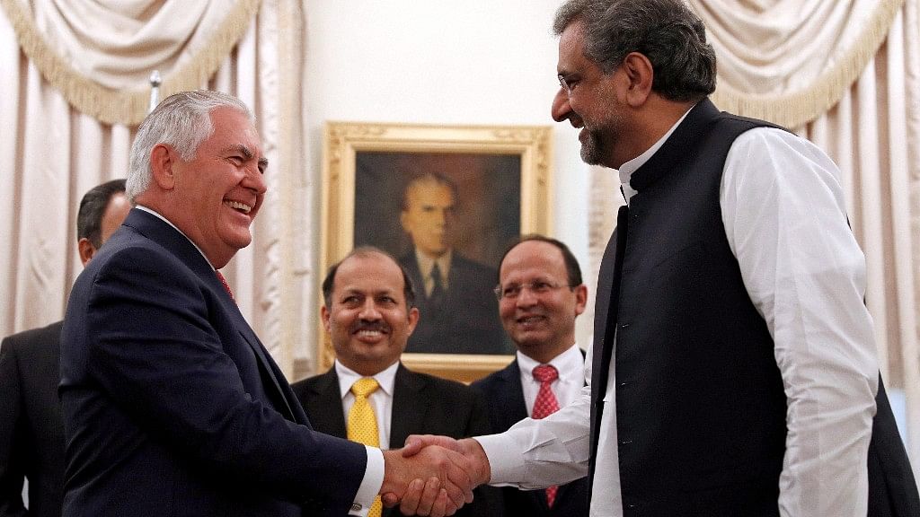 U.S. Secretary of State Rex Tillerson shakes hands with Pakistani Prime Minister Shahid Khan Abbasi, before their meeting at the Prime Ministers residence, Tuesday, in Islamabad, Pakistan.