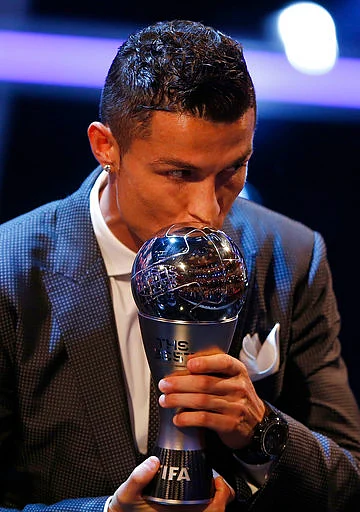 Portuguese soccer player Christiano Ronaldo holds the Best FIFA Men’s player award during The Best FIFA 2017 Awards at the Palladium Theatre in London.