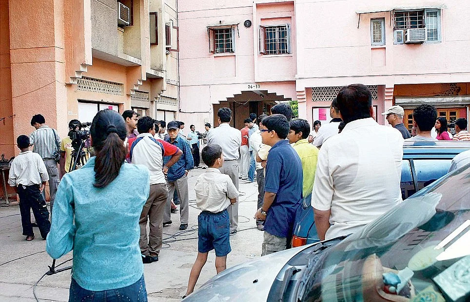 Jal Vayu Vihar residents and media outside the Talwars’ residence in Noida after Aarushi’s murder on 16 May 2016.