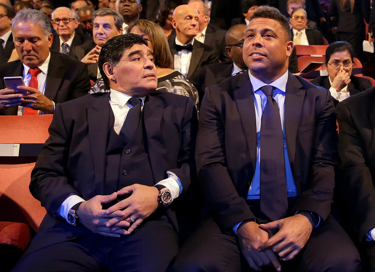 Argentinian soccer legend Diego Armando Maradona, left, sits beside Brazilian soccer legend Ronaldo during the The Best FIFA 2017 Awards at the Palladium Theatre in London.