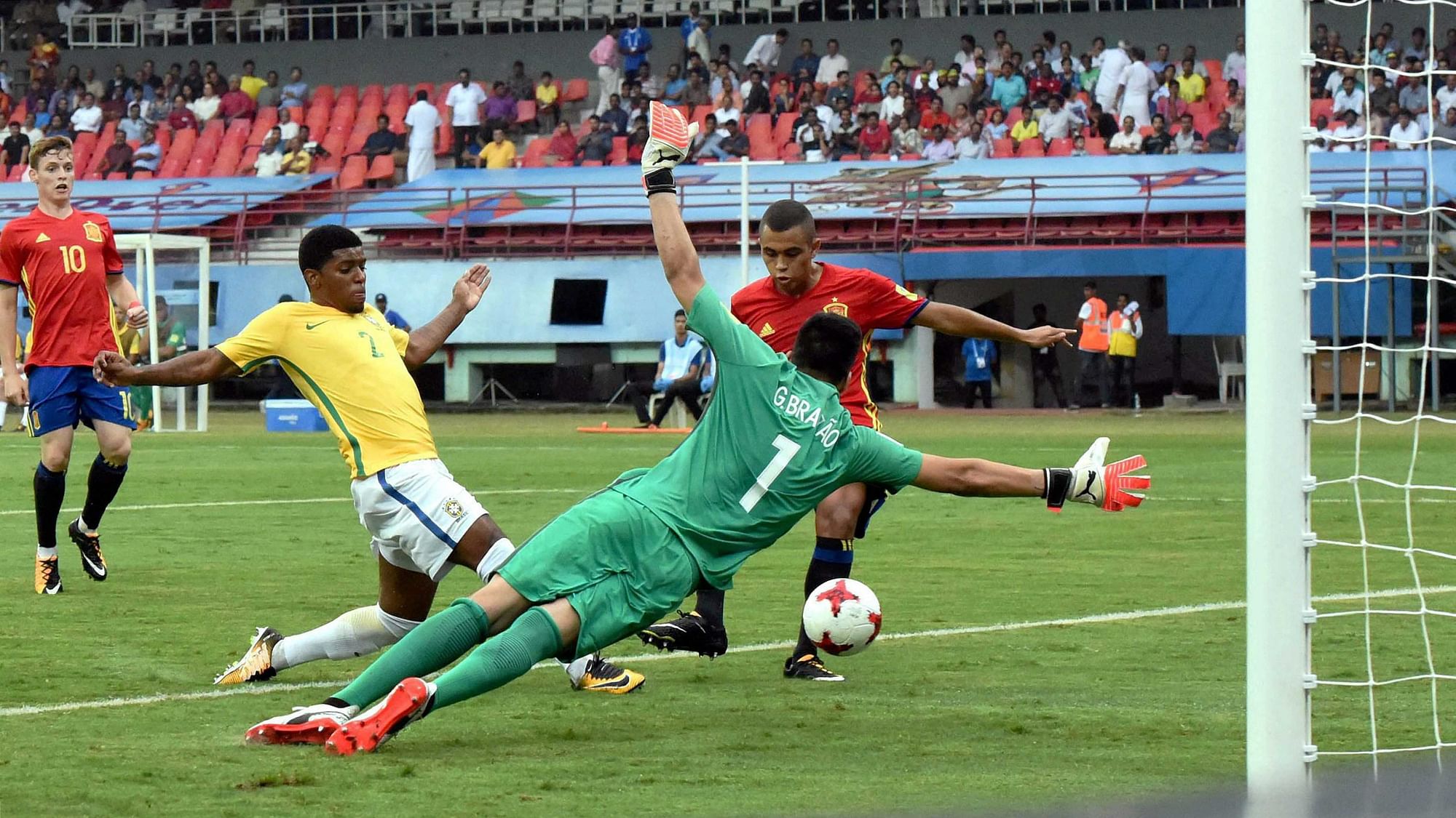 Kochi: Spain’s Mohamed Moukhliss, in red, scores a goal against Brazil during their U-17 FIFA World Cup match in Jawaharlal Nehru International Stadium