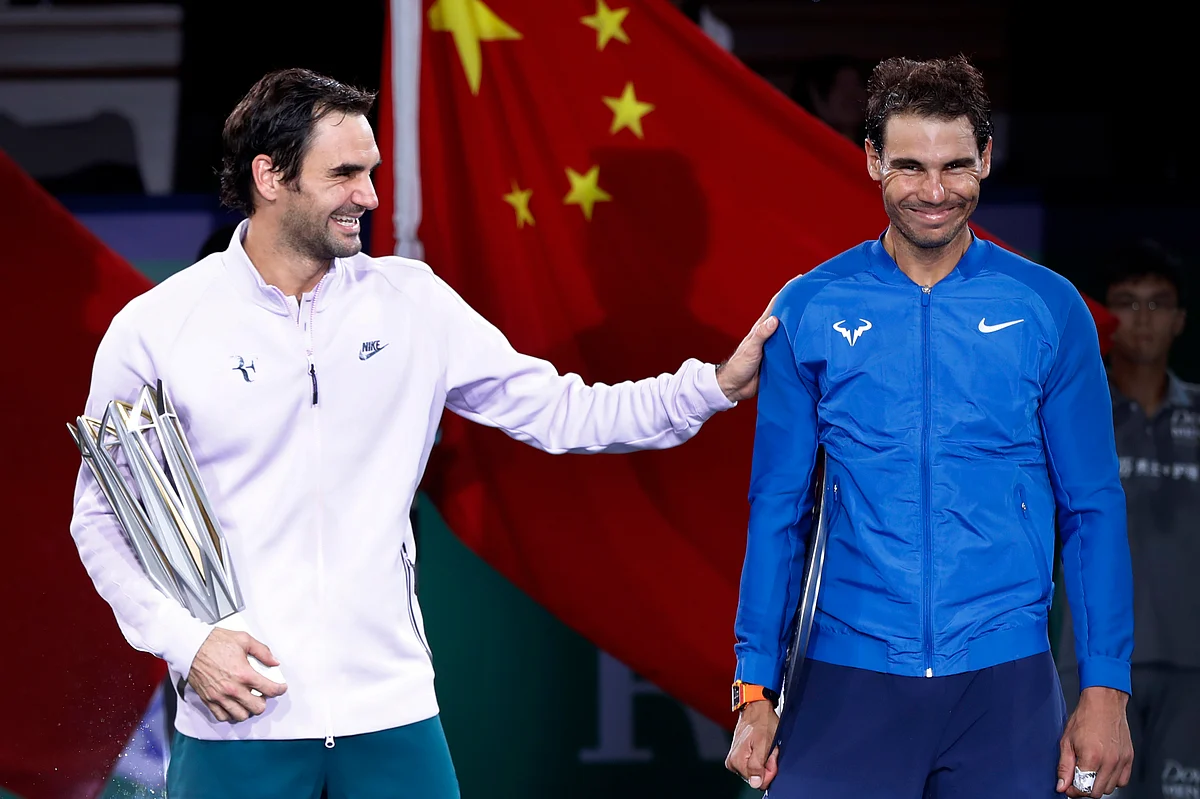Roger Federer of Switzerland, left, shares a light moment with Rafael Nadal after winning their men’s singles final match in the Shanghai Masters tennis tournament at Qizhong Forest Sports City Tennis Center in Shanghai, China, Sunday
