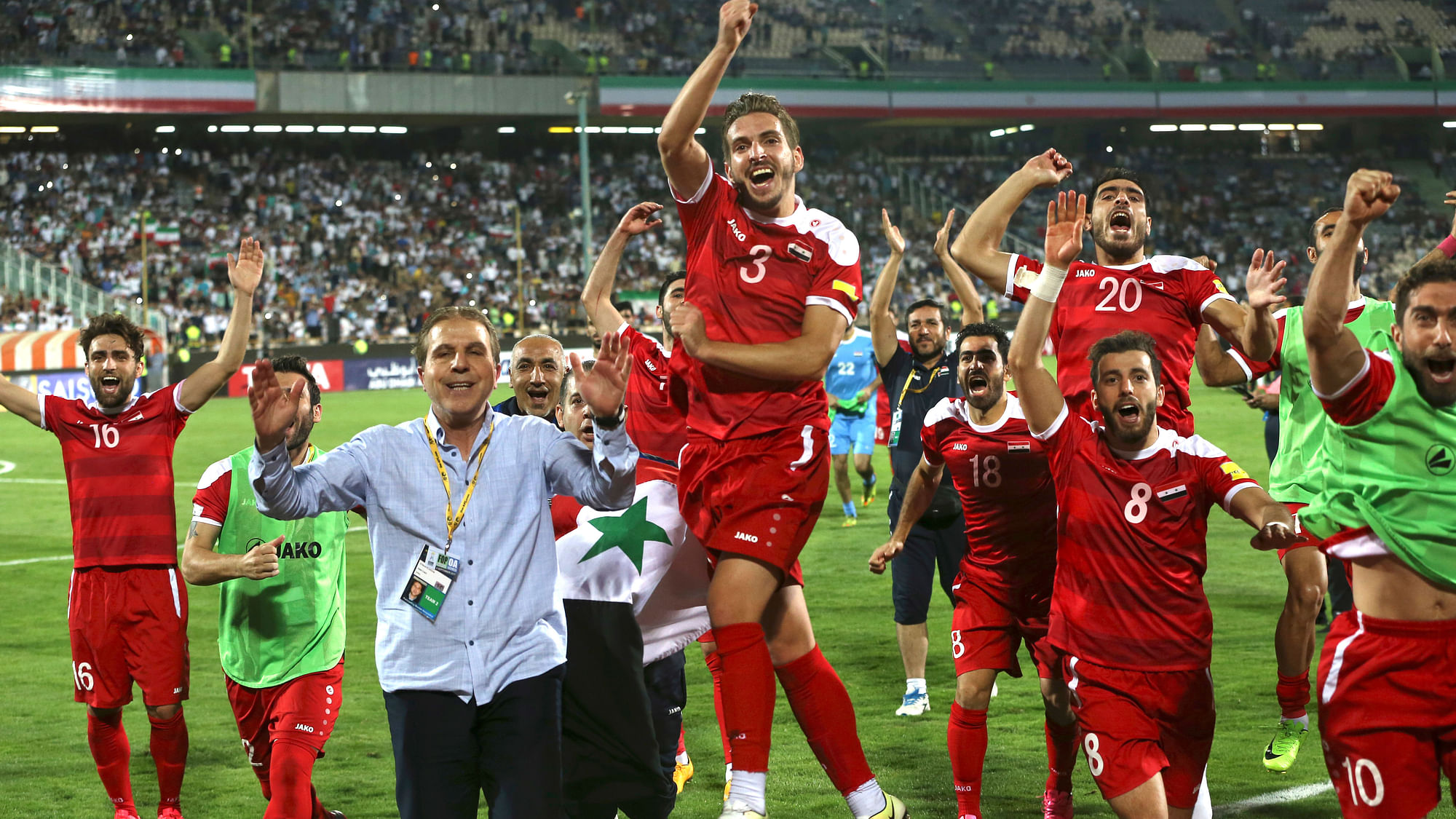 Syria’s national soccer team celebrates at the conclusion of their match with Iran which drew 2-2 during their Round 3 - Group A World Cup qualifier.