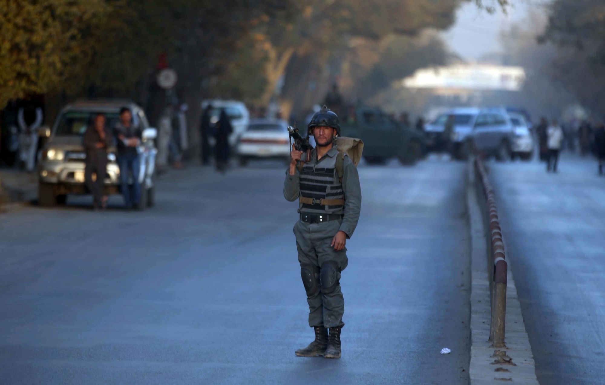 A policeman stands guard at the site of a suicide attack in central Kabul, Afghanistan.