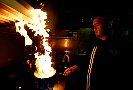 Chef Thitiwat Tantragarn cooks giant water beetle raviolis at Insects in the Backyard restaurant, in Bangkok, Thailand.