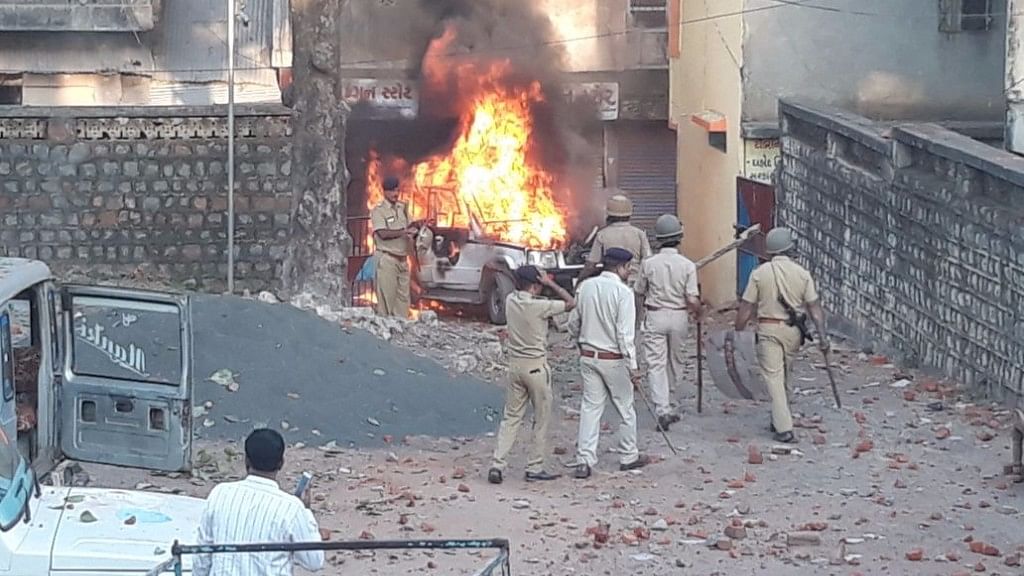 Angry residents of the tribal village of Jesawada in Gujarat attacked local policemen and set their vehicles on fire.