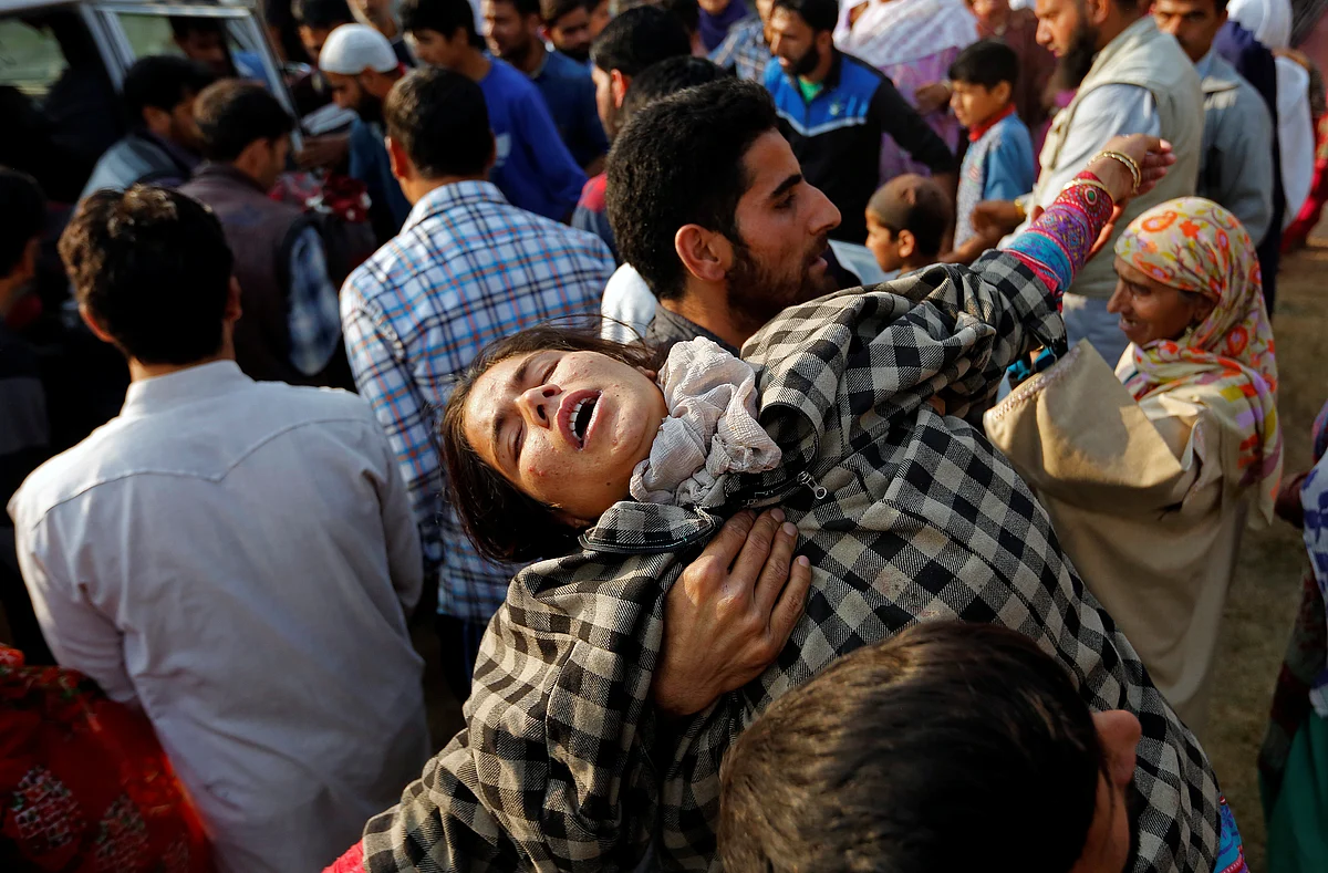 A relative of Yasmeena mourns during her funeral in Khonmoh, south of Srinagar.