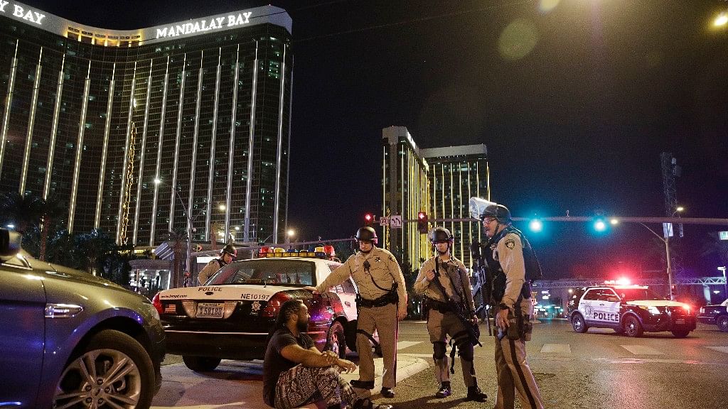 Police officers stand at the scene of the shooting near the Mandalay Bay resort and casino on the Las Vegas Strip.