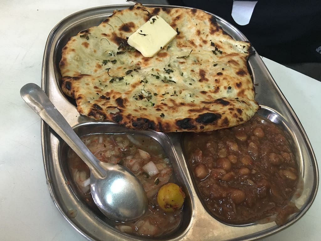 What makes dhaba food so delectable? Is it the coal-flavoured paratha or  melting pools of white butter in the dal?