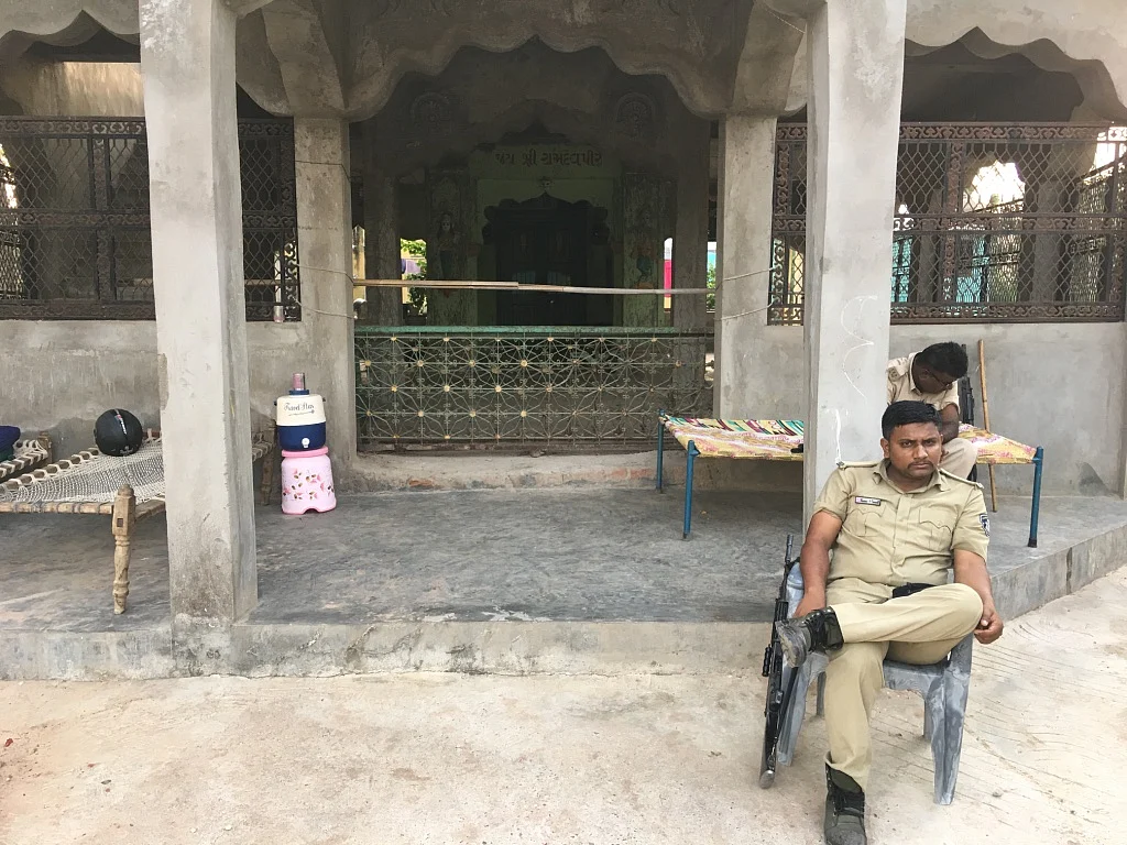 Officials of the State Reserve Police force are sitting guard outside Digant Maheriya’s house in Limbodara.